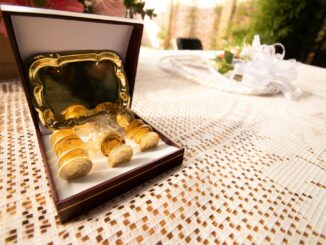 an open box of gold nuggets sitting on a table
