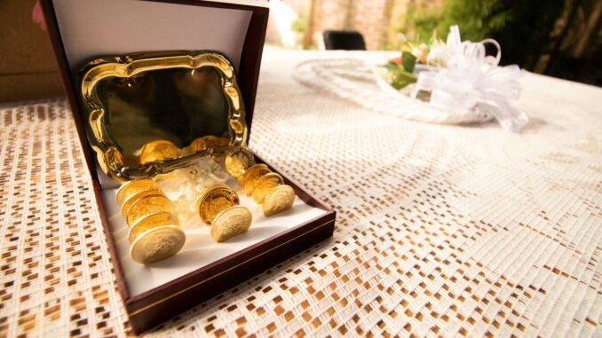 an open box of gold nuggets sitting on a table